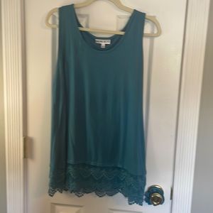 Teal sleeveless shirt with lace detail on bottom. Never worn . No tags